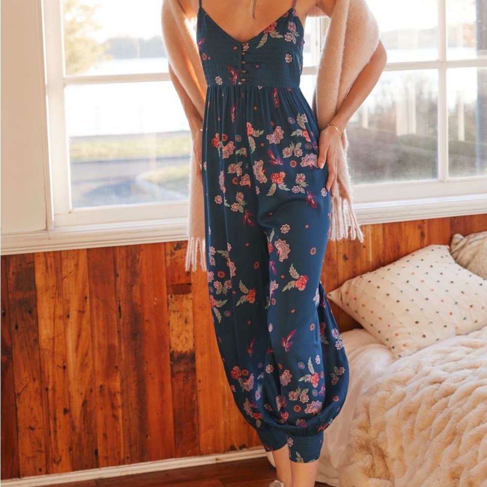 XS Anthropologie jumpsuit in blue with colorful detailing.